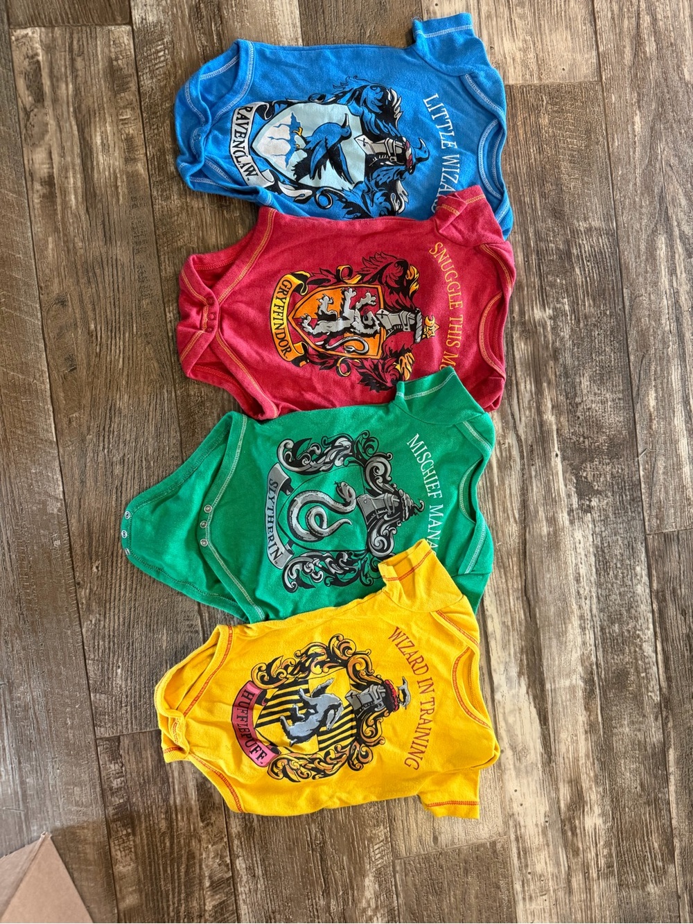 Warner Bros. Set of 4 Baby Bodysuits - Blue, Red, Green, Yellow Hogwarts Houses